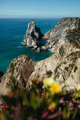 Panoramic view on the Altantic Ocean and the famous rock formations of Praia da Ursa, near Cabo da Roca in Portugal