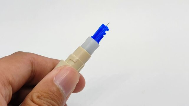 Removing blood lancet needle on white background