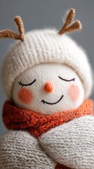 A cozy handmade snowman with a scarf and antlers embodies winter cheer in a soft, inviting setting