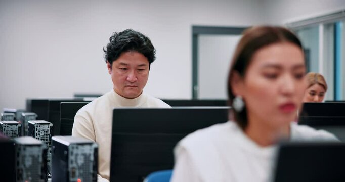 Computer, business training and people in center for research, growth or development in office. Technology, Japanese men and women in coworking space for online course, productivity or web management