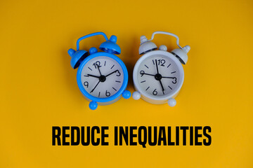 two blue and white alarm clocks on yellow background with text of REDUCE INEQUALITIES. no. 10 goals...