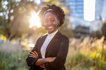 Portrait of a smiling young woman in the city
