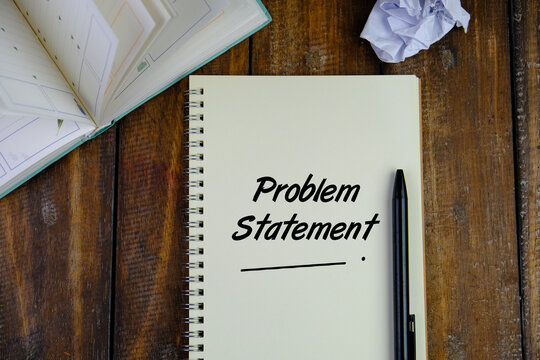 Top view image of book and pen with Problem Statement wording. 
