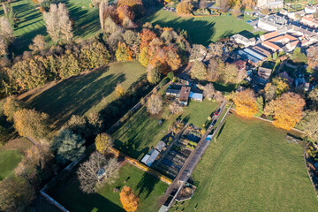 Aerial photo of the beautiful British town of Bedale which is a market town in the Hambleton former district of North Yorkshire in the UK showing houses and public park in the Autumn time