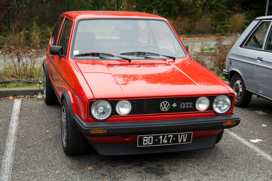 Mulhouse - France - 10 November 2024 - front view of red volkswagen golf GTI MK1 parked in the street