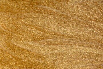 Shiny golden texture background. Golden surface pettern. top view.