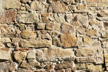 The photo shows a close-up of a stone wall