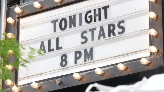 Retro marquee sign and light bulbs. Movie theater or cinema theatre vintage facade signage. Letters about tonight show. New York City street iconic old architecture, USA. Performing arts advertisement