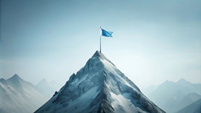 A lone blue flag stands atop a snow-capped mountain peak, signifying achievement and success in a vast, serene landscape.