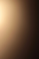 Blurred beige gold brown background with light spots and shadow play. Abstract texture with color gradient