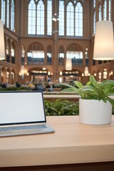 Fototapeta premium Blurred Bookshelf Background With Open Laptop, A Workspace Design With Natural Light,