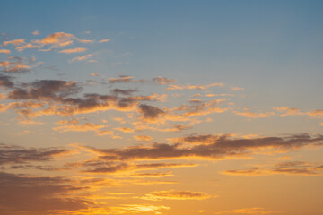 Photo background texture, beautiful sky during sunset with clouds of colored shades.