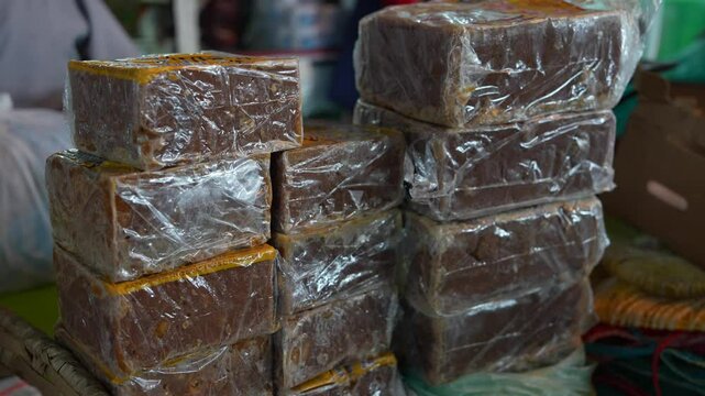 Panela, Rapadura or Chancaca Blocks at Local Farms Market in South America. Isolated. Close Up