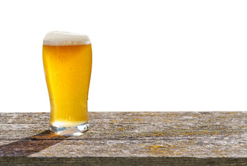 A glass of cold beer placed on a table