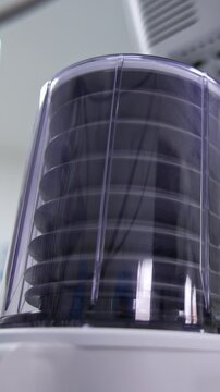 Doctor looks at the pump of lung ventilator machine. Medic separates ambu bag from a tube and the pump falls and stops. Low angle view. Blurred backdrop. Vertical video