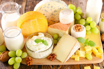 various dairy products on wooden board