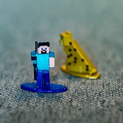 Naklejka premium Closeup shot of a Minecraft Steve toy figurine made of metal