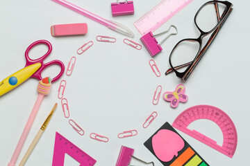  A vibrant collection of office and school supplies, including scissors, pens, sticky notes, paper...