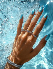 A hand with rings and a bracelet, featured in a jewelry ad campaign for jewelry brand, in the style of water surrealism photography.Copy space,flat lay