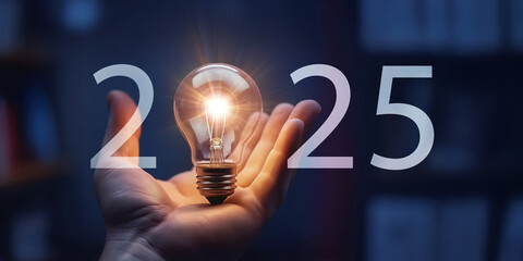 2025 New Year greeting card, lightbulb in hand palm glowing in darkness, bright success best wish