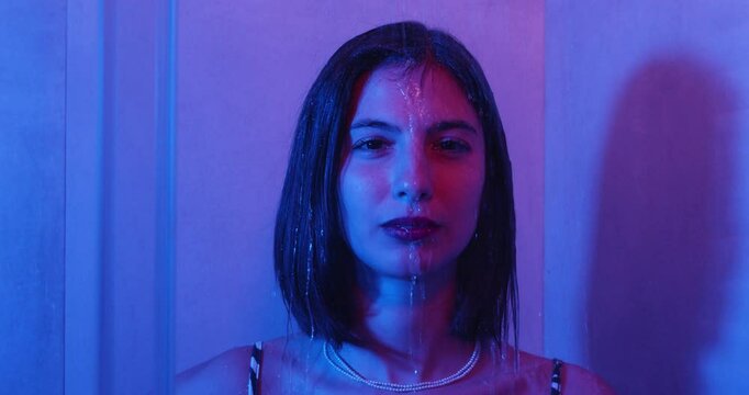 Girl turns on the shower, dressed and soaking wet, overwhelmed with a problem