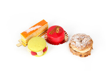 Various cakes arranged on a white background