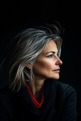 Fototapeta premium confident middle-aged woman under neon lights, embodying individuality and an active lifestyle. This modern, expressive portrait captures the energy and positivity of urban life and self-expression.