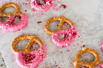 Homemade Gourmet: Delightful Pretzels Adorned with Pink Chocolate and Sprinkles