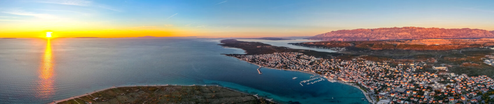 Croatia, panorama of city of Novalja on the Pag Island at sunset time. Concept travel in Croatia