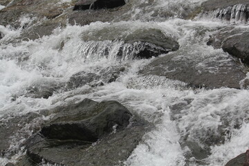 Beautiful image of flowing waves of clear water of Daecheongcheon Stream