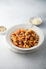 Pasta with tomato sauce and smoked ham
