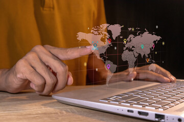 Man touching a virtual screen of world map infographic. World map infographic with color pointers.