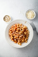 Pasta with tomato sauce and smoked ham