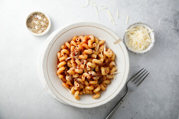 Pasta with tomato sauce and smoked ham