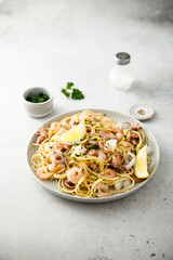 Spaghetti with seafood, parsley and lemon