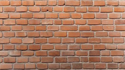 Brick wall with uniform pattern of red bricks and gray mortar in close-up photography.