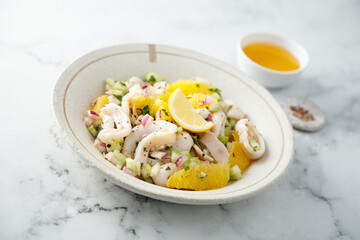 Squid salad with orange and red nion