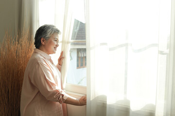 woman looking out window