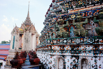 Awesome view of Wat Arun in Bangkok, Thailand. The Buddhist temple is a landmark of Bangkok and a...