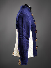 Historical fashion. Medieval knight cloth. Padded jacket gambeson.