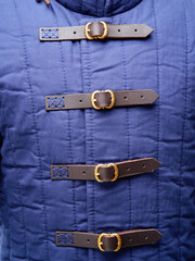 Historical fashion. Medieval knight cloth. Padded jacket gambeson.