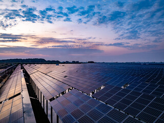 Solar photovoltaic panels array aerial photography at sunset