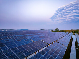 Solar photovoltaic panels array aerial photography at sunset