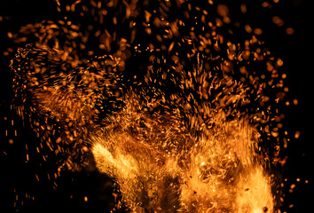 fire flame with sparks on black background.