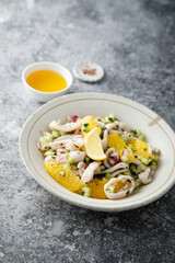 Squid salad with orange and red nion