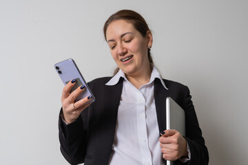 Young business woman holding laptop