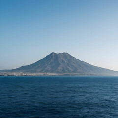 Beautiful shot of sea with a mountain in the distance and a clear sky