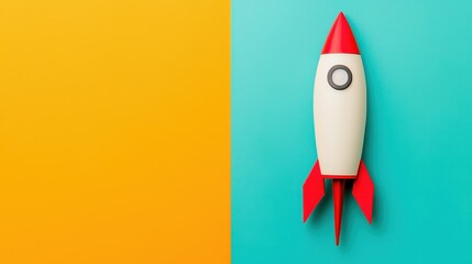 A colorful rocket toy on a vibrant split background of orange and teal, symbolizing creativity and innovation.