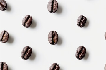 Fototapeta premium Patterned Layout of Isolated Coffee Beans on White Background for a Minimalist Design; Perfect for Coffee Lovers and Culinary Projects