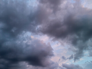 Dramatic sky with dark clouds and hints of blue, creating a moody atmosphere at dusk.